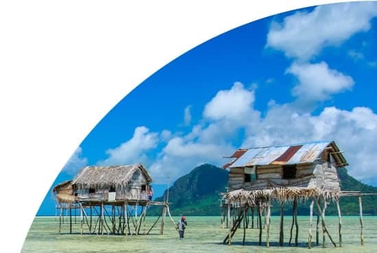 Houses on stilts in shallow water in Borneo