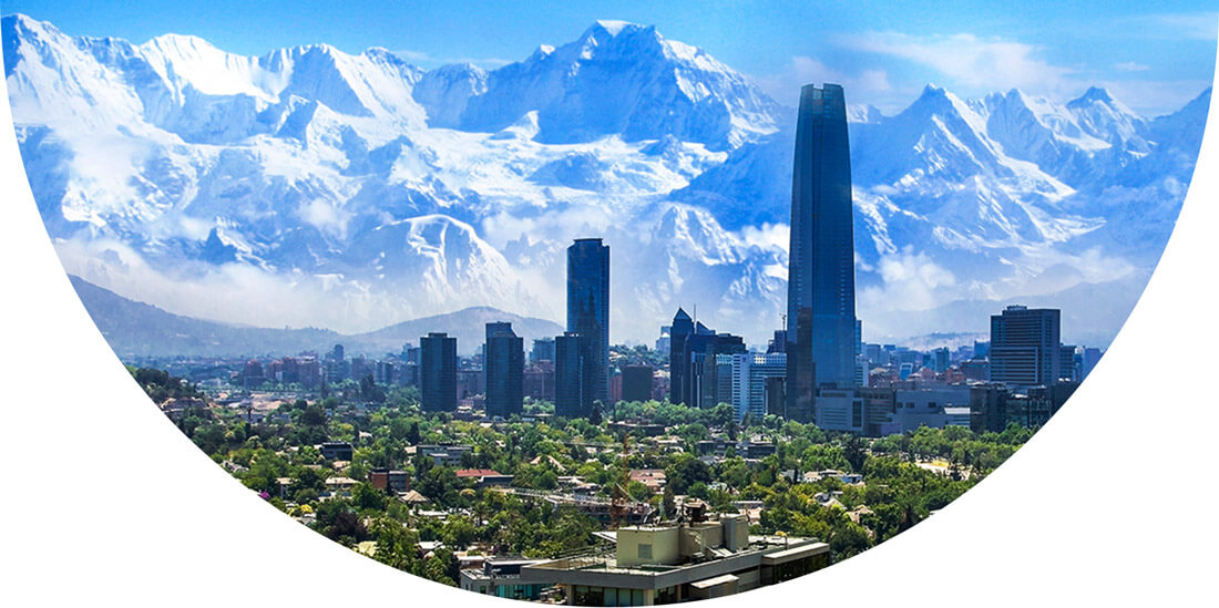 City skyline in front of snowy mountains in Santiago, Chile