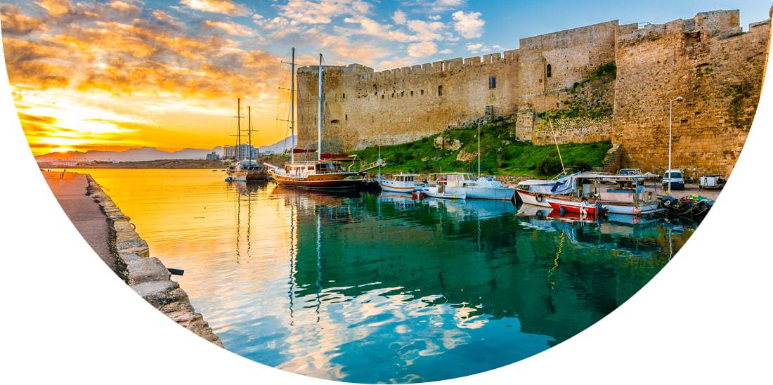 Harbour with boats next to a castle in Cyprus