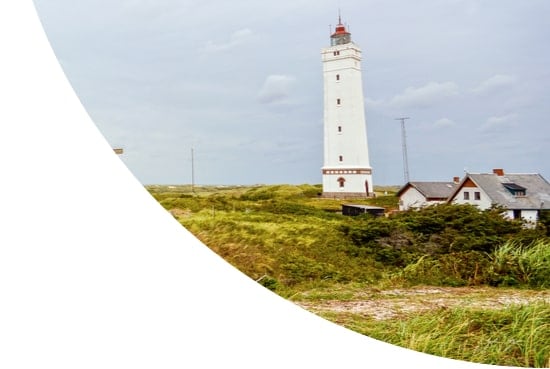 Lighthouse on a beach in Blavand, Jutland, Denmark