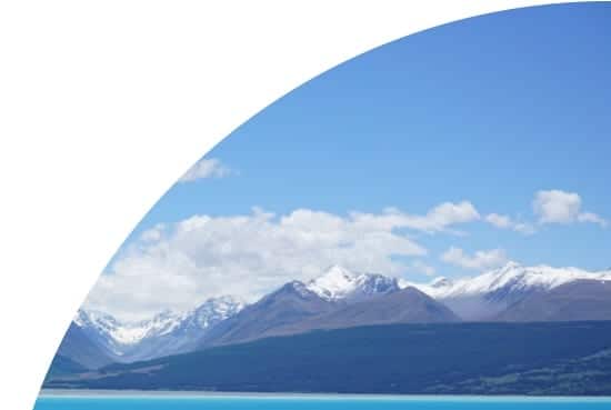 Snowy mountains by a lake in New Zealand