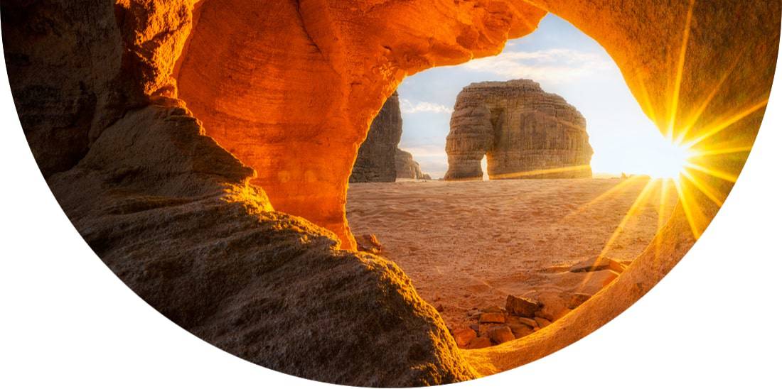Sun shining through Elephant rock in Saudi Arabia