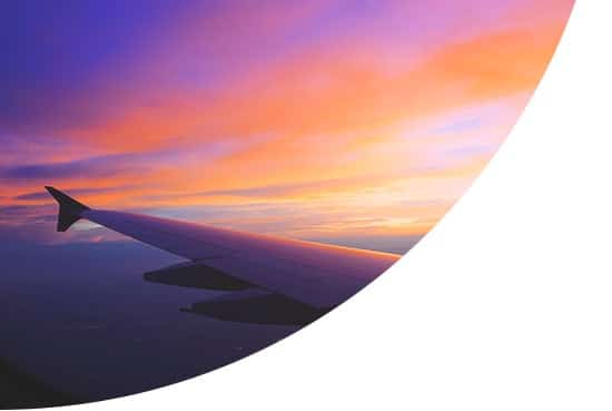 The wing of an aeroplane at sunset