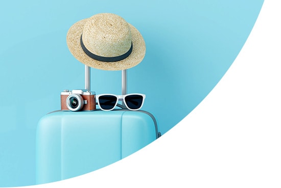 Hat, camera and sunglasses on top of a suitcase
